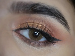 Solenza Desire Agarwood colored contacts, showing a close-up of a brown-toned contact lens with subtle flecks.