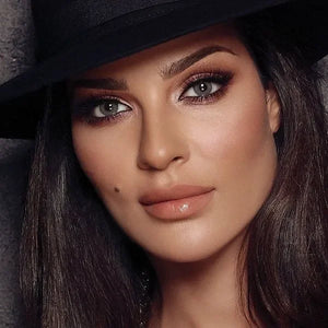 Bella Elite Amber Gray Lenses shown up close, highlighting their subtle color blend and natural appearance.