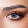 Bella Elite Amber Gray Lenses, a pair of striking gray contact lenses with subtle amber tones, shown up close.