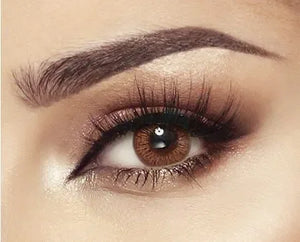 Bella Elite Cinnamon Brown Lenses: Close-up on a pair of brown contact lenses with subtle cinnamon tones.