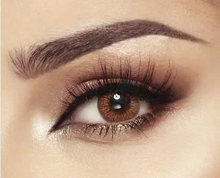Bella Elite Cinnamon Brown Lenses: Close-up on a pair of brown contact lenses with subtle cinnamon tones.