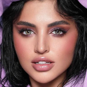 Close-up of Bella Elite Emerald Green Lenses, showcasing their vibrant green hue and subtle limbal ring.