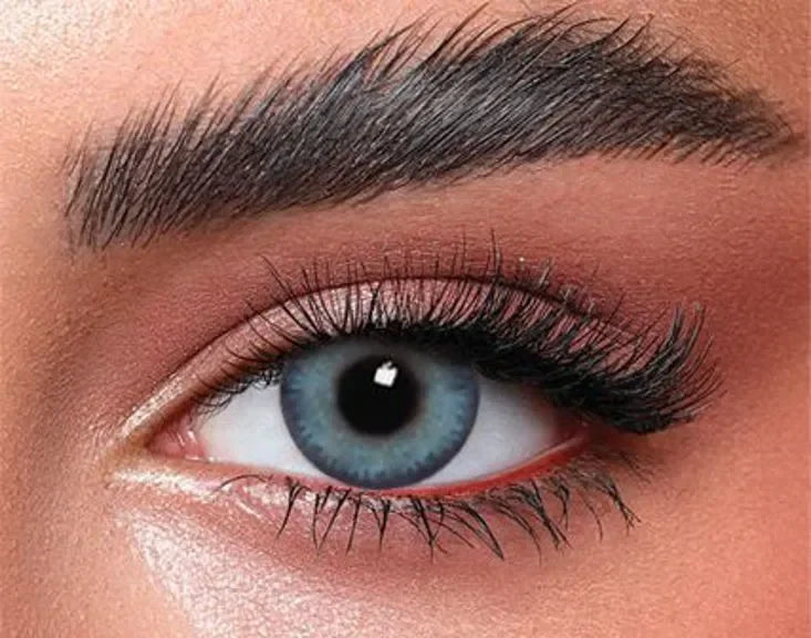 Close-up of Bella Glow Navy Gray Lenses, showcasing their subtle color and natural appearance on an eye.