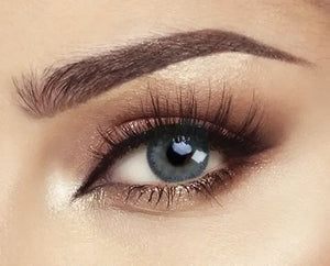 Close-up of Bella Glow Navy Gray Lenses, showing a dark navy iris with subtle gray flecks.