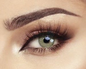 Bella Elite Emerald Green Lenses, showcasing a vibrant emerald green colored contact lens with a subtle limbal ring.