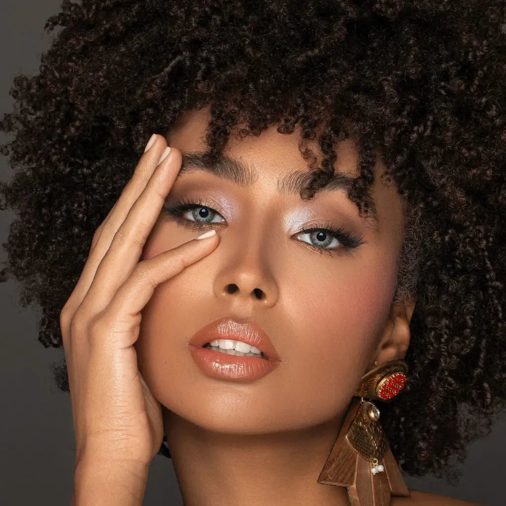 Pair of Bella One Day Garnet Lenses in a clear blister pack, showcasing a deep red-brown color.