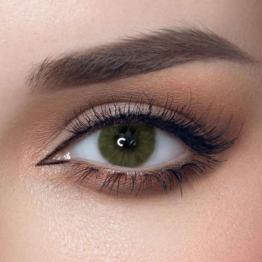 Solenza Desire Olive Green Colored Contacts, showcasing a close-up of one contact lens with a subtle olive green hue.