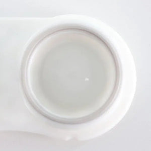 Close-up of a pair of Blind White Halloween Lenses, showcasing their opaque white, pupil-less design.
