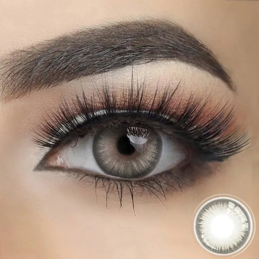 Savage Grey 1-Year Color Lenses, close-up on a blue eye with striking grey contact lenses.