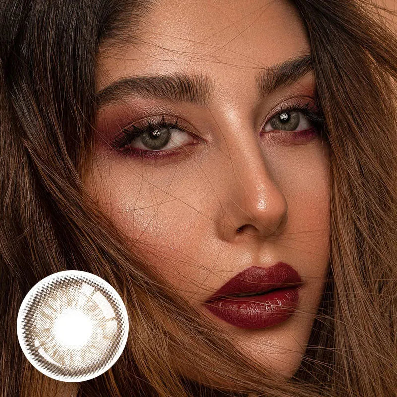 Unspoken Brown 1 Yearly Lenses in a clear case, showcasing a subtle, natural brown iris color.