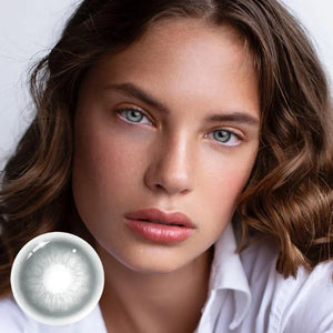 Unspoken Gray 1 Yearly Lenses: A pair of soft contact lenses in a clear blister pack, showcasing a subtle gray hue.