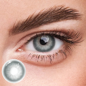 Unspoken Gray yearly contact lenses, a pair of soft gray lenses on a clean white background.