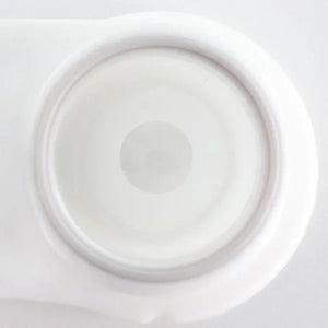Close-up of white out Halloween lenses, creating a solid white, opaque eye effect.